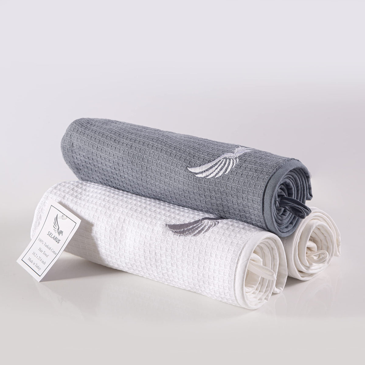 SELARUS turban on bathroom shelf showing luxury cotton softness and travel-ready benefit