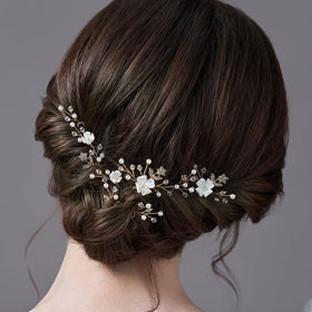SELFCLOUD close-up of white flower and pearl detail highlighting handcrafted texture and delicate shine benefit