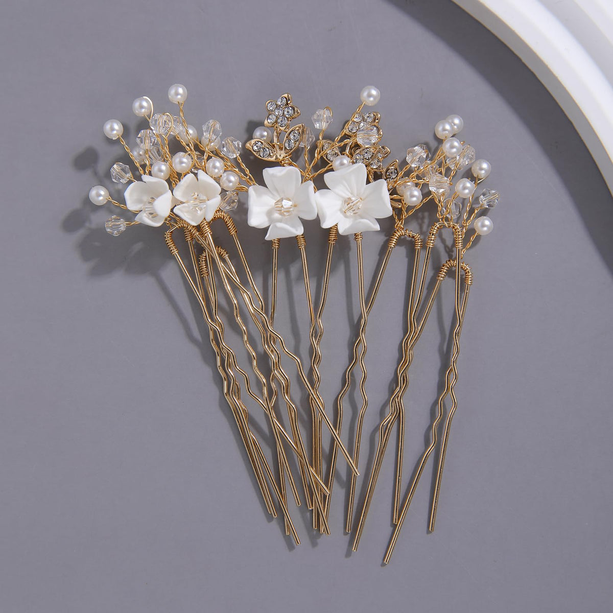 SELFCLOUD pins inserted in bridal updo to show real-wear styling and refined finishing touch benefit