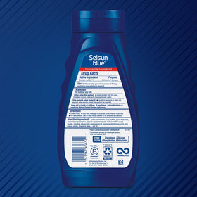 Selsun Blue bottle close-up label highlighting 1% selenium sulfide strength