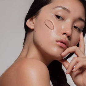 Sente tube in hand showing 1.7 oz size and travel-friendly convenience benefit