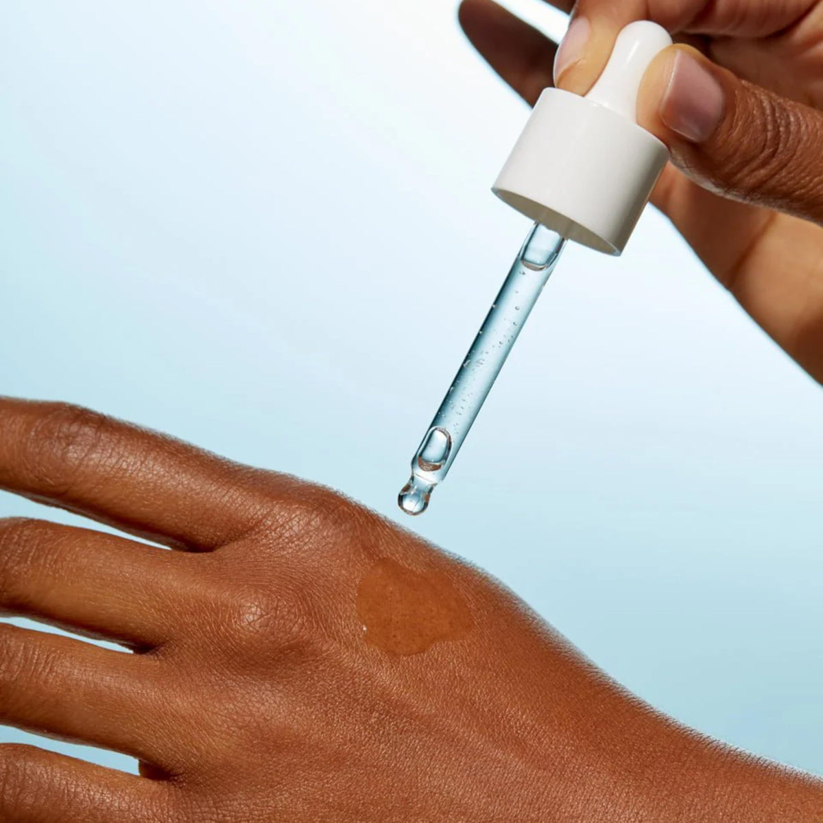 Senté serum layered under moisturizer, showing compatibility and smooth layering benefit