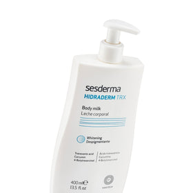 Sesderma bottle held in hand for size comparison, indicates generous 13.5 fl oz supply