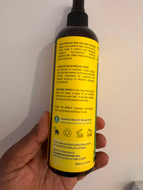 Seven Minerals bottle beside a freshly cut aloe leaf indicating purity