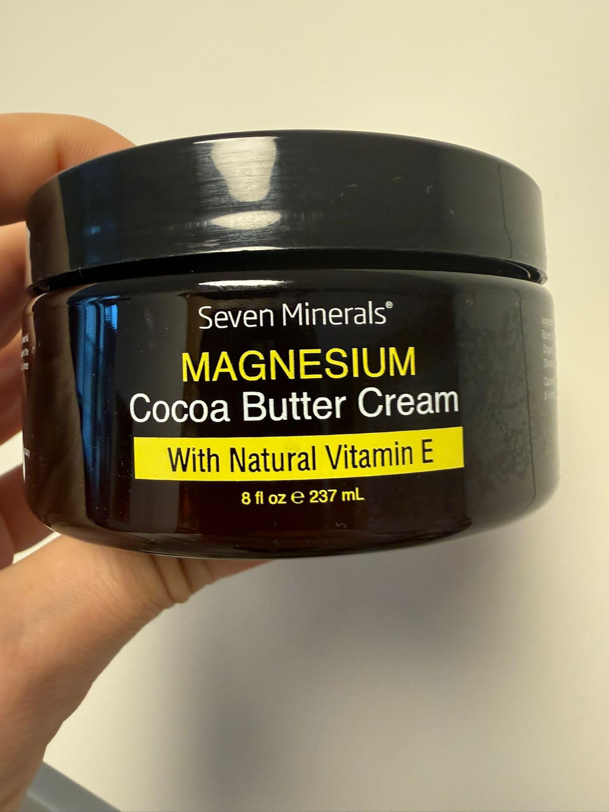 Seven Minerals jar beside measuring cup showing 8 fl oz size benefit