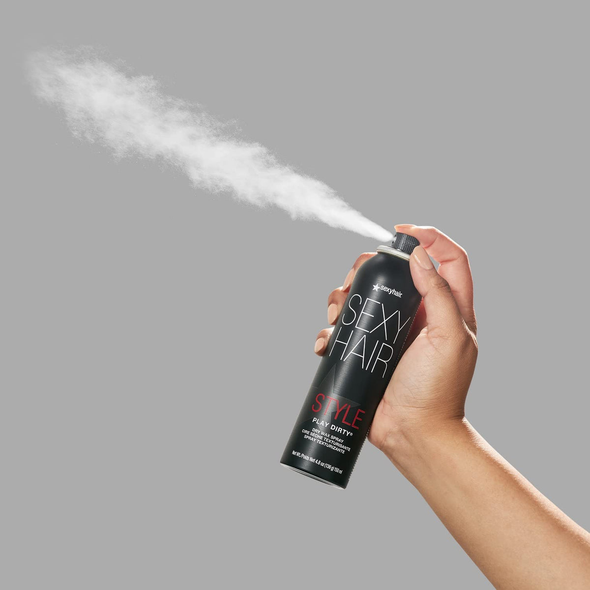 SexyHair bottle in hand for size comparison and travel-friendly benefit