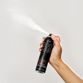 SexyHair can held in hand to show 4.4 oz scale and portable styling