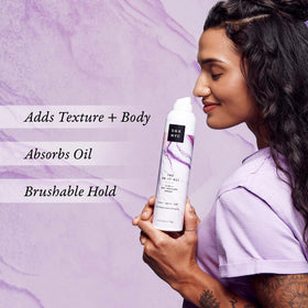 SGX NYC texture spray in hand showing size and travel-friendly benefit