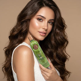SHAEIO shampoo lather in hand demonstrating gentle cleansing