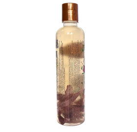 SHAEIO lifestyle bathroom shelf with bottle showing premium botanical aesthetic and routine use