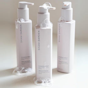 SHANI DARDEN bottle on bathroom shelf showing everyday routine fit