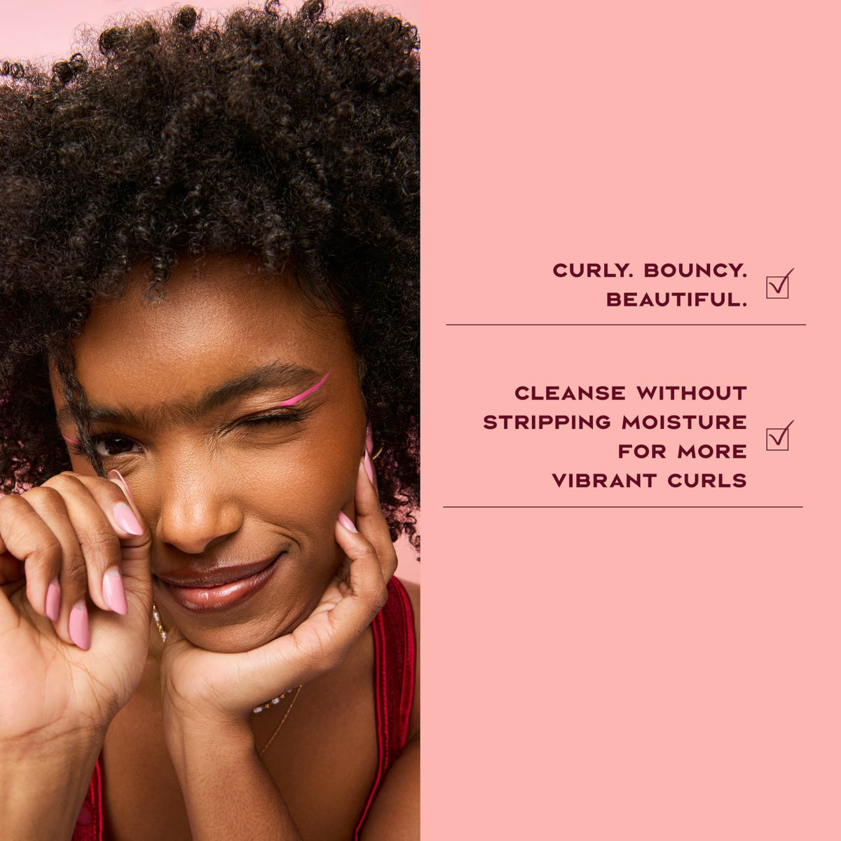 Shea Moisture shampoo applied to curly hair in shower showing effective cleansing action
