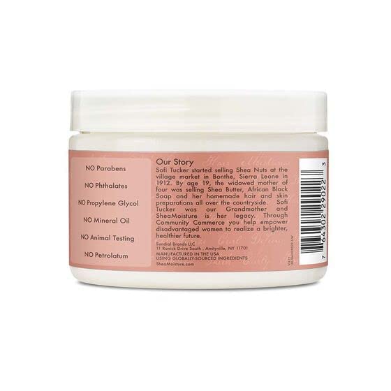 Shea Moisture scoop in hand demonstrating portion size for styling benefit