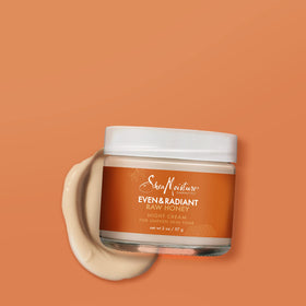 SheaMoisture 2 oz jar in hand demonstrating compact travel-friendly size
