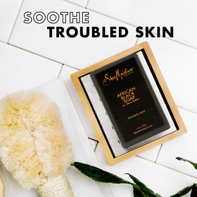 Shea Moisture bar paired with clarifying toner to suggest step-by-step use