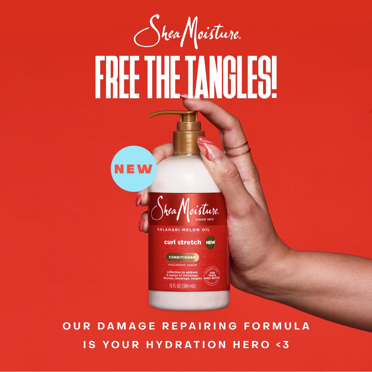 Shea Moisture refresher spray in hand misting hair to revive and reduce frizz