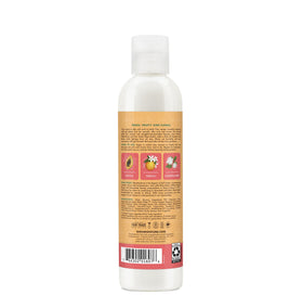 Shea Moisture applied to damp curls demonstrating frizz control