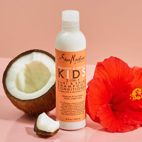 8 oz SheaMoisture kids bottle in adult hand for size comparison and travel convenience