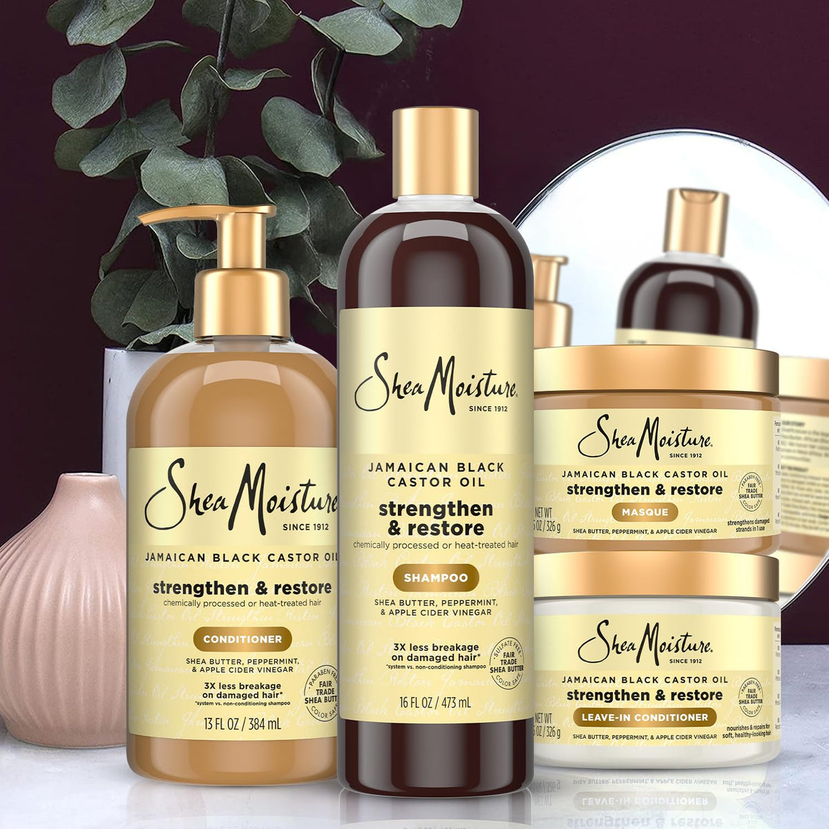 SheaMoisture leave-in being applied to damp hair to show easy detangling benefit