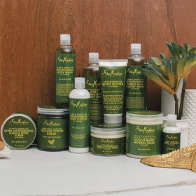 SheaMoisture bottle held in hand for scale to show generous 8 oz benefit
