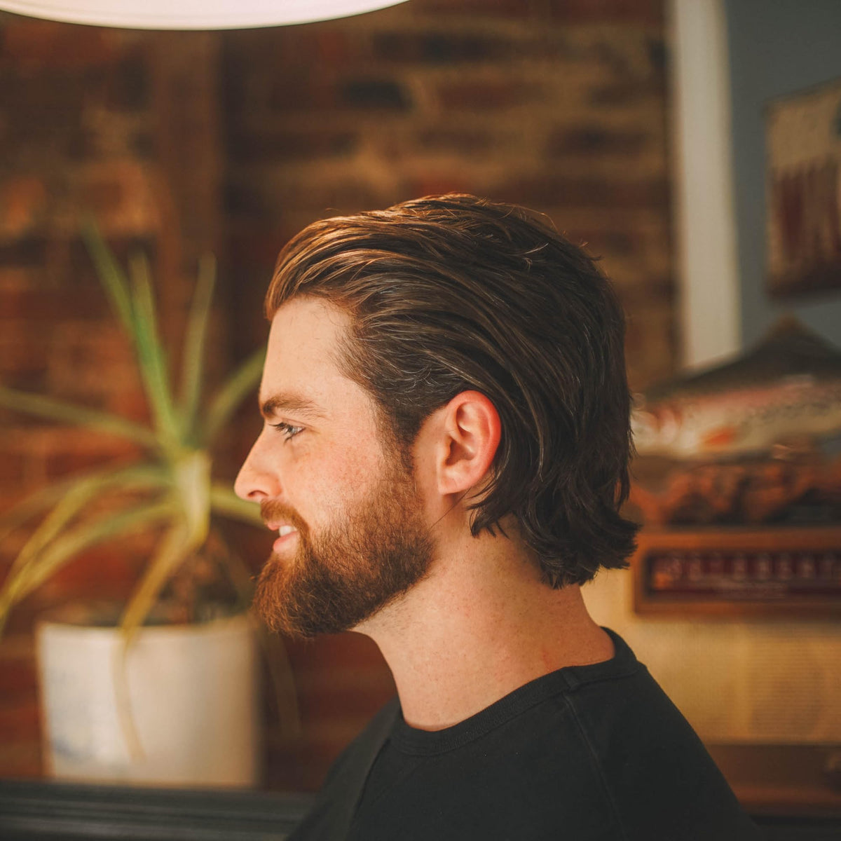Shear Revival jar on bathroom shelf illustrating travel-friendly grooming