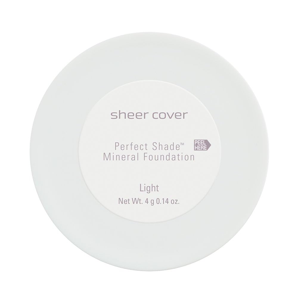Sheer Cover brush applying powder on skin demonstrating buildable natural coverage