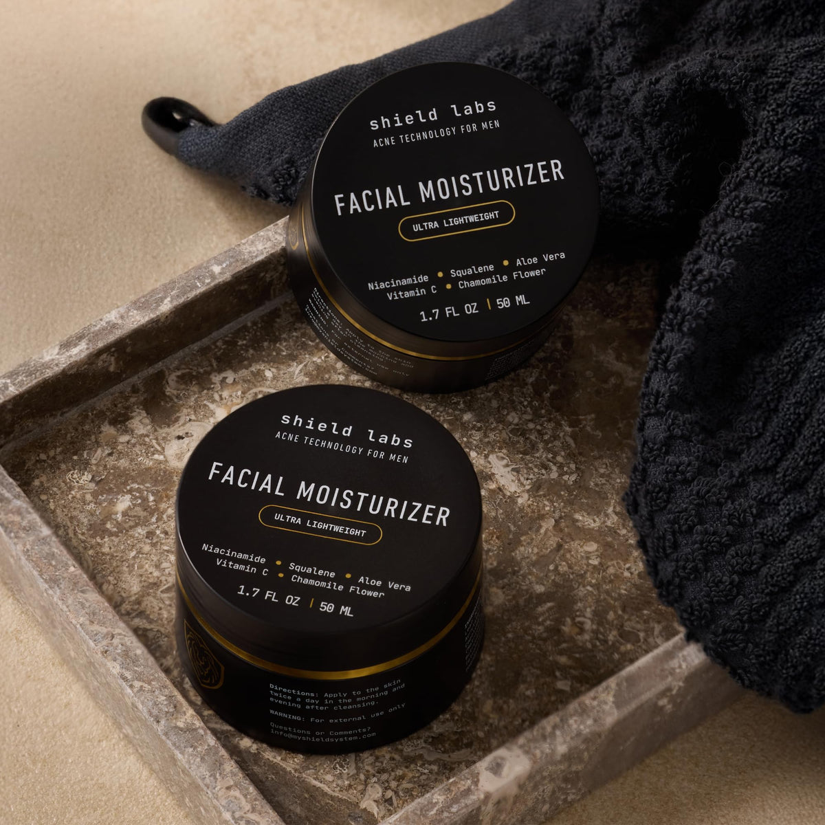 Shield moisturizer used after shaving in bathroom showing calming benefit