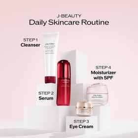 Shiseido 50 mL tube beside coin for size comparison and travel convenience