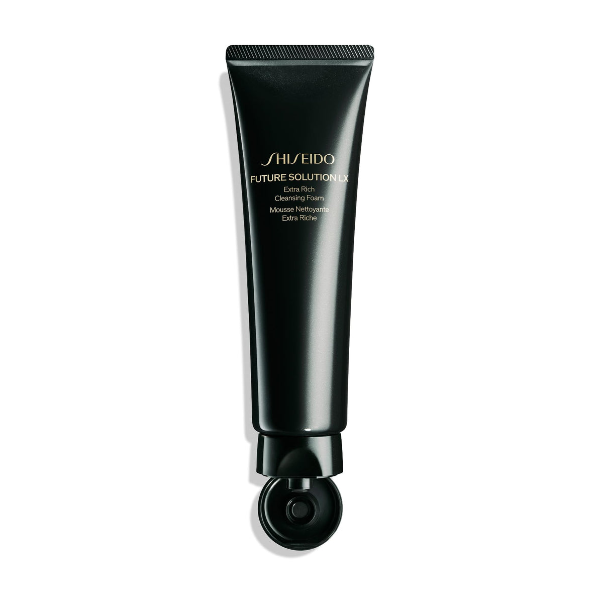 Shiseido 125 mL bottle next to coin showing product size and travel convenience