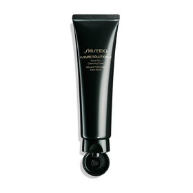 Shiseido 125 mL bottle next to coin showing product size and travel convenience