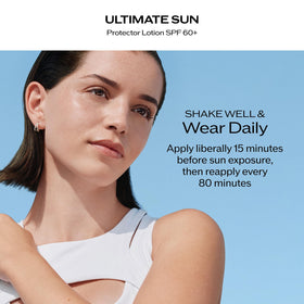 Hand holding Shiseido sunscreen pump to show product size and ease