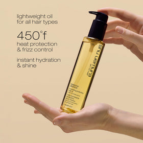 shu uemura art of hair oil applied to palm demonstrating smooth spread
