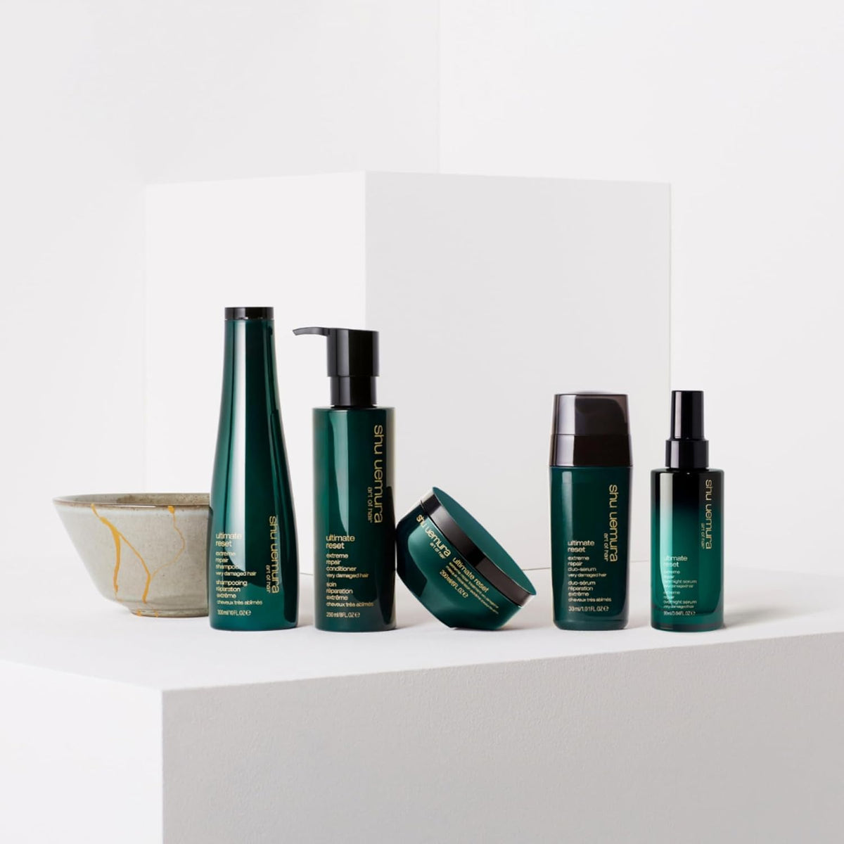 shu uemura art of hair on bathroom shelf implying daily repair ritual