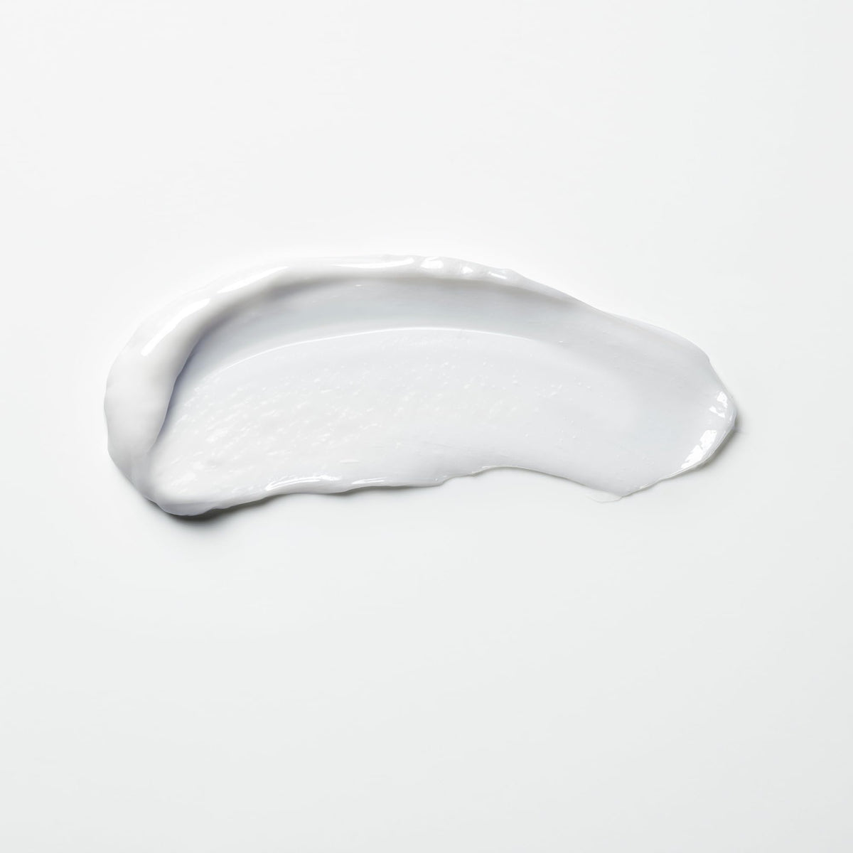 shu uemura art of hair bottle next to hand to show travel-size portability