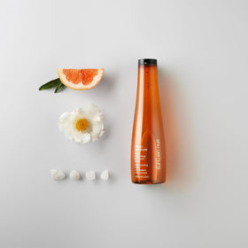 shu uemura shampoo lather on wet hair illustrating gentle cleansing and frizz control