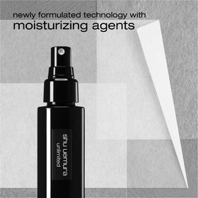 shu uemura bottle in hand for size and portability reference benefit