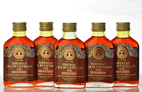 Siberian Treasure label and glass bottle detail emphasizes cold-pressed origin