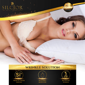 SILCÍOR pad beside a hand showing compact size and portability