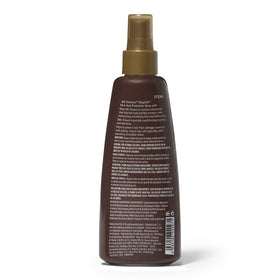 Silk Elements spray in use on damp hair demonstrating even mist for smooth, frizz-reduced styling