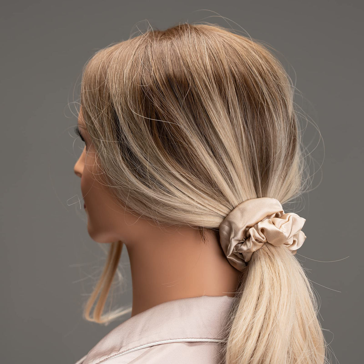 Silmer silk scrunchie securing a ponytail, demonstrating gentle hold and reduced creasing
