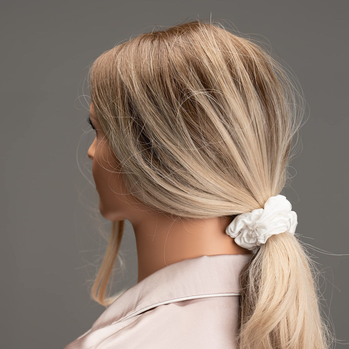 Silmer scrunchie worn in ponytail demonstrating gentle grip and no creasing benefit