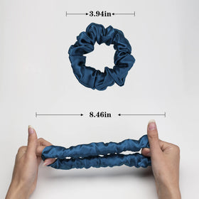 Silmer scrunchie next to a coin illustrating compact size and easy portability