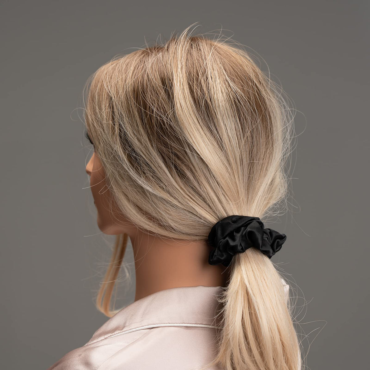 Silmer scrunchie size shown in hand for scale and comfortable fit benefit