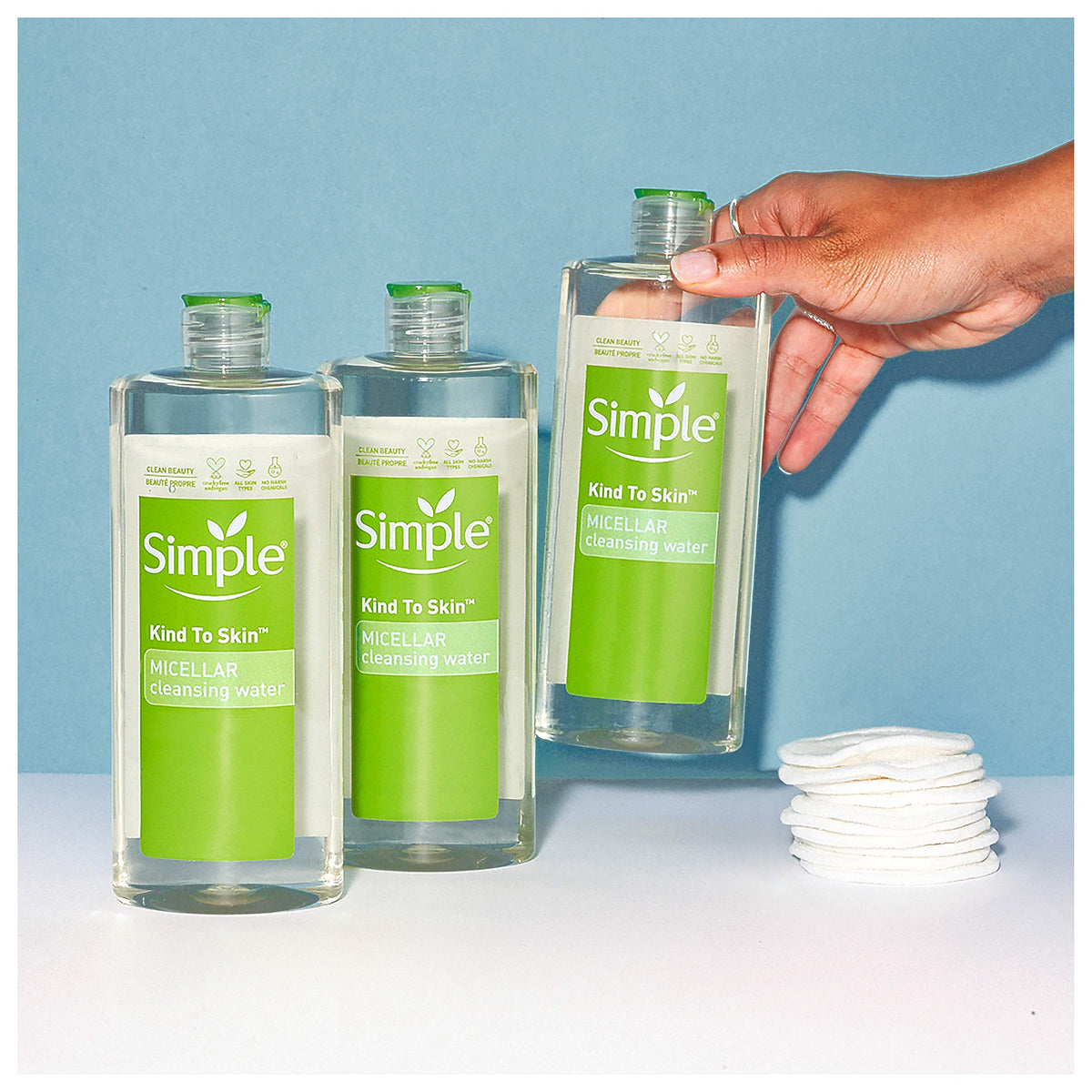 Simple micellar cotton pad in use removing makeup quickly and gently