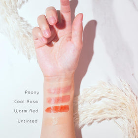 Simple Sophistication tin beside coin for size comparison and travel-friendly benefit