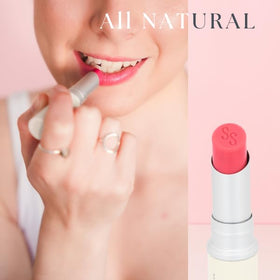 Simple Sophistication applying balm to lips for instant softening benefit