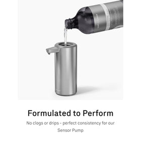 simplehuman bottle held beside hand to show scale and convenient refill benefit