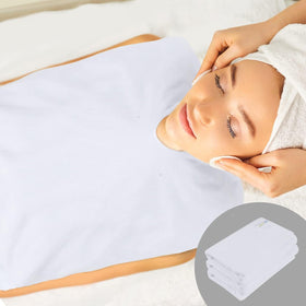 SINLAND folded towels stacked in salon setup indicating organized reusability