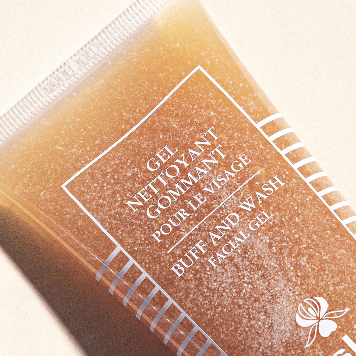 Sisley Paris product in use being massaged into skin delivering refreshed feel