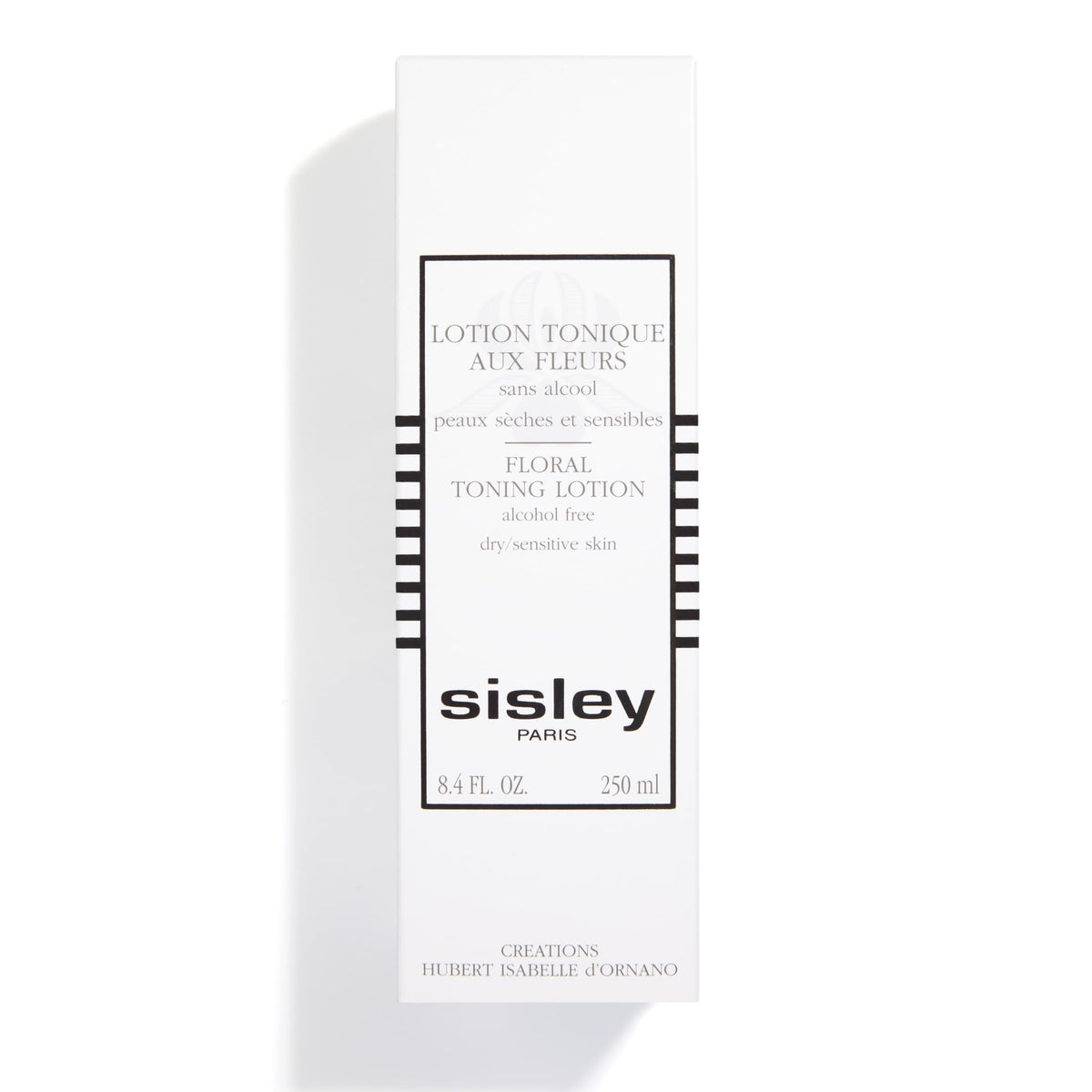 Sisley Paris bottle next to everyday items showing 250 mL scale
